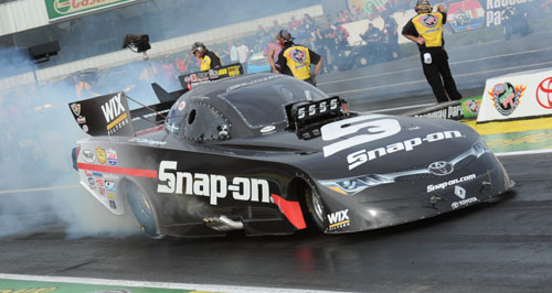 (Cruz Pedregon set low ET in qualifying with a track record - 3.967 secs(