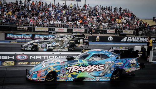 (John Force - far lane - defeated his daughter Courtney in the fuel FC final at Denver)