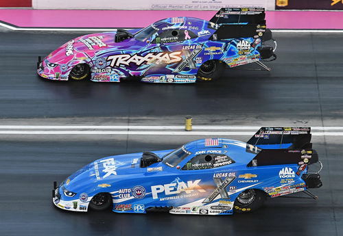 (John Force scored an exciting final round win over his daughter Courtney in the Las Vegas fuel FC final round)